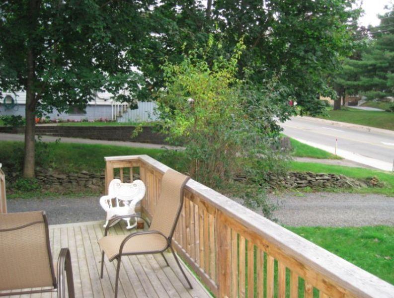 Central, bright two-story (3 bedrooms, 1.5 baths), private deck