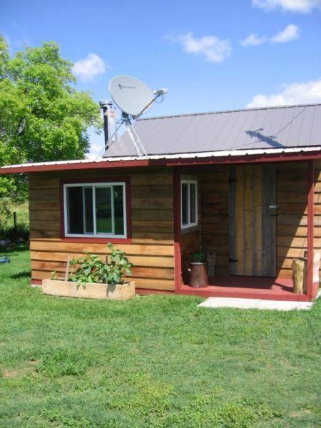 Quarter section with winterized cabin and outbuildings