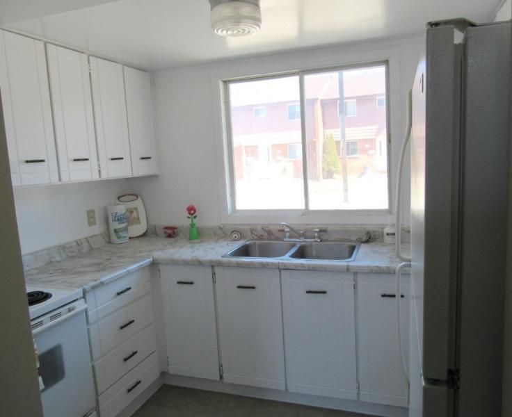 Warm 3 Bedroom Townhouse with Parking + 1 Month Free