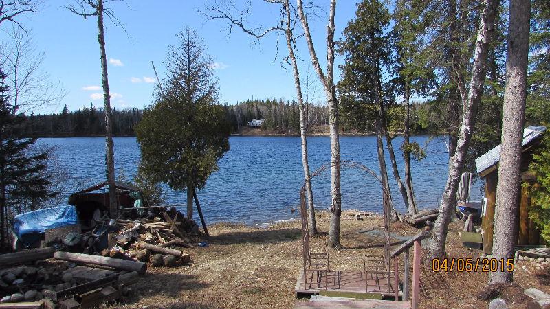 Enjoy Nature's Serenity in this beautiful lakeside Log Cabin