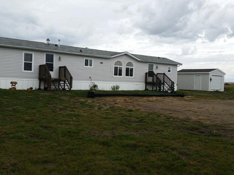 Acreage just mins west of Sexsmith fenced for horses awaits you!