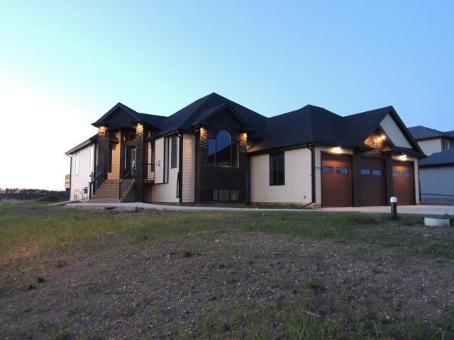 EXTRAORDINARY CUSTOM BUILT BUNGALOW WITH TRIPLE CAR GARAGE!