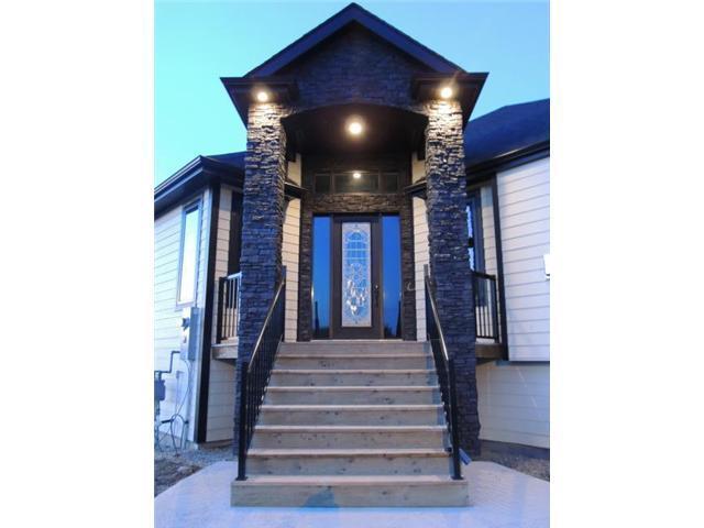 EXTRAORDINARY CUSTOM BUILT BUNGALOW WITH TRIPLE CAR GARAGE!