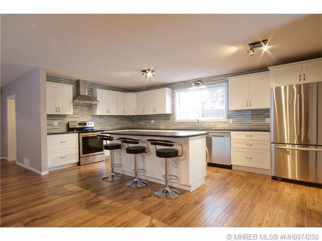 RENOVATED 3 BEDROOM HOME IN REDCLIFF WITH SINGLE DETACHED GARAGE