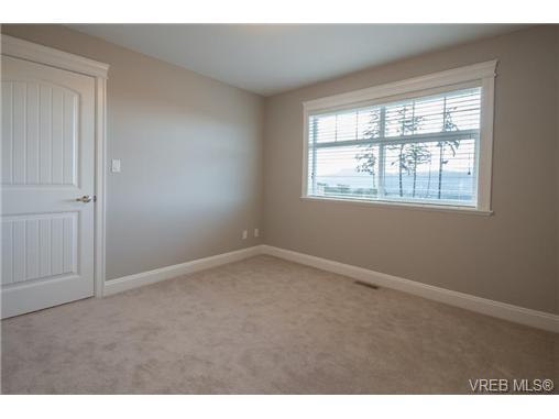 Downstairs offers a bright den spacious laundry room