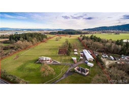 Sprawling 25.92-acre farm with ocean views & two residences!