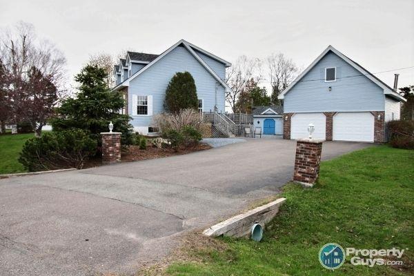 Adorable Cape Cod with large, detached two bay, 2 story garage