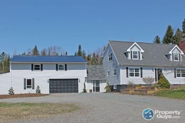 Modern Cape Cod with Attached 2 level Garage!