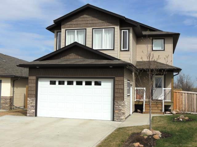 2100 SQ FT FULLY DEVELOPED 2 STOREY IN SEXSMITH IS A MUST SEE!