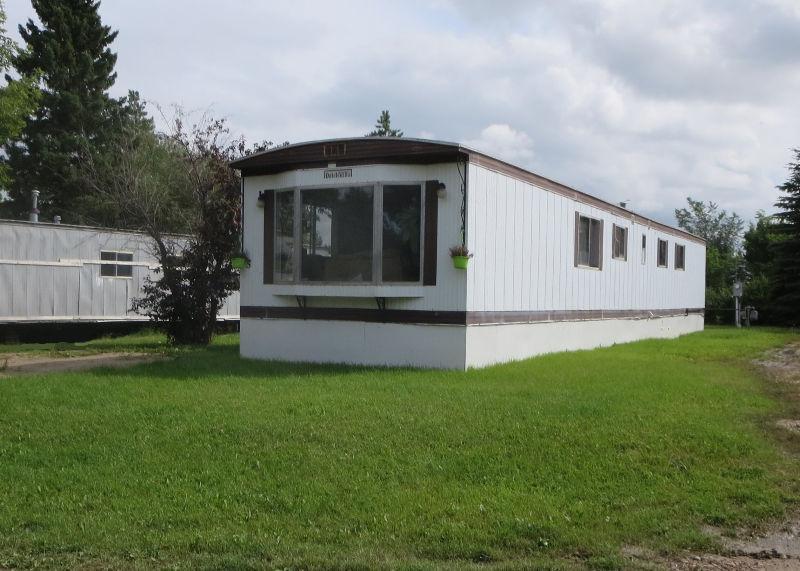 Bright mobile home in Unity, SK with large green space