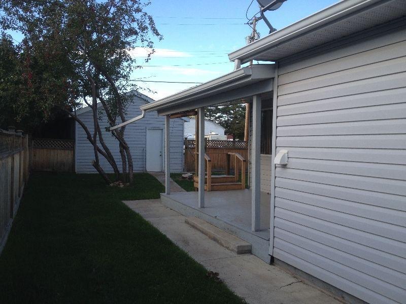 OWN THIS HOME OR TWO SIDE BY SIDE HOMES WITH GARAGES