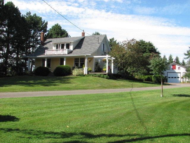 Acreage, huge barn and lovely home