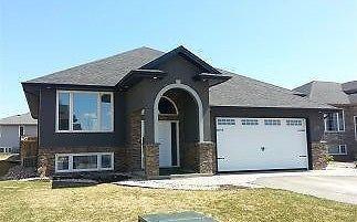 Modern home, beautifully landscaped!