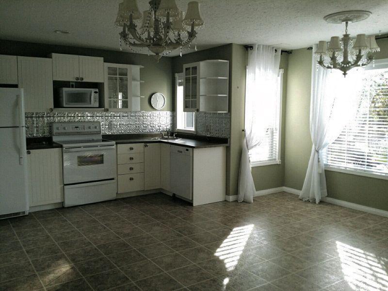 MORINVILLE ~ Bright Walk-Out Suite in Garden Setting