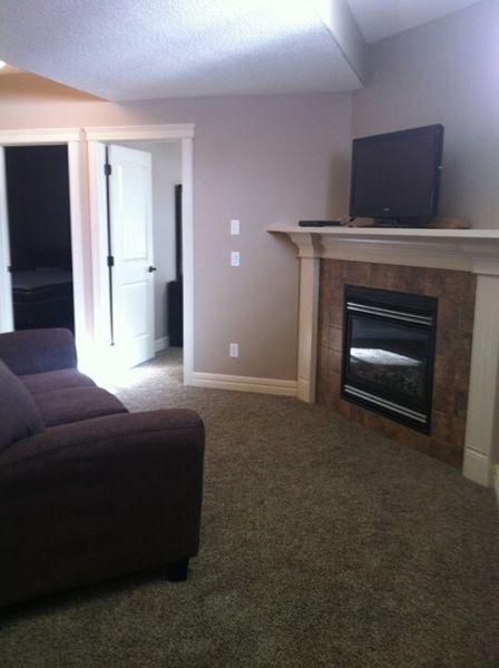 FULLY FURNISHED 2 BDRM LEGAL SUITE, SEP. ENTR. AND LAUNDRY