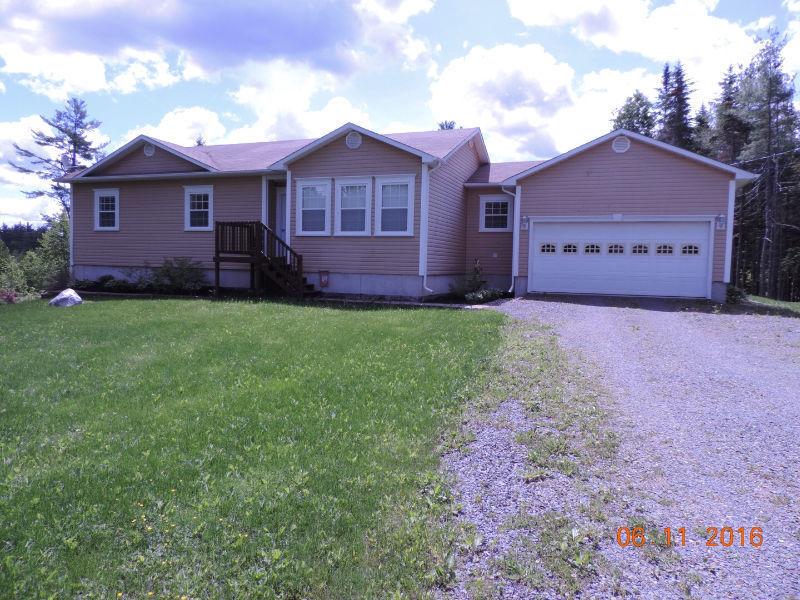 Open concept bungalow with attached garage