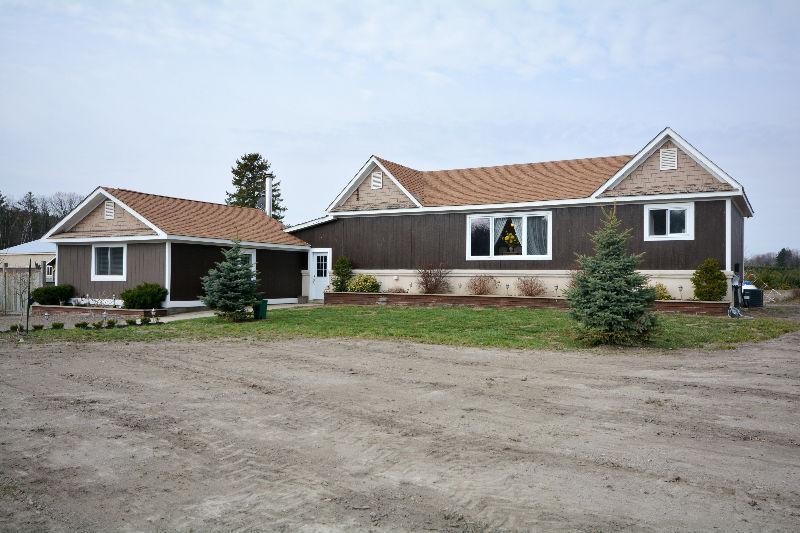2 houses on 5 acres with Shop and huge garage.. make us an offer