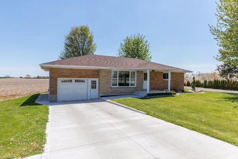 BRICK RANCH IN COUNTRY WITH 2 LARGE OUTBUILDINGS