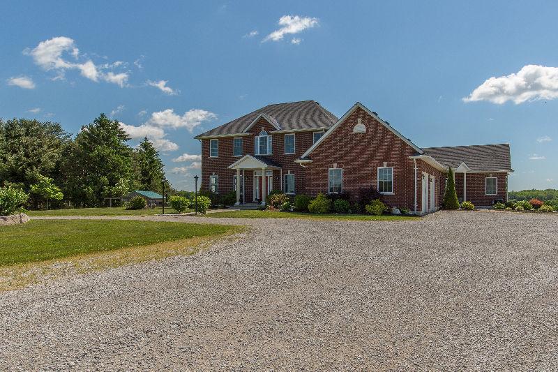 21.5 acres with custom built home w/inlaw/guest suite