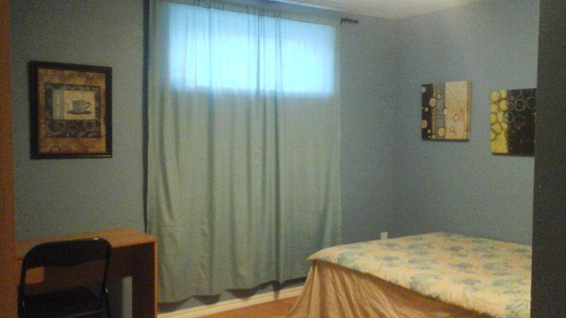 Nice room in basement for rent in decent house east