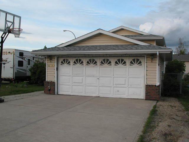 This home has a double attached garage and a single car garage
