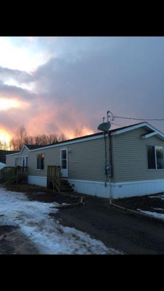 REDUCED $10,000! Newer 3 bed 2 bath mobile home on greenspace