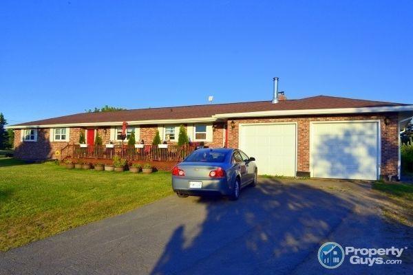 Lovely 3 bedroom rancher is situated on 6.9 gently sloping acres