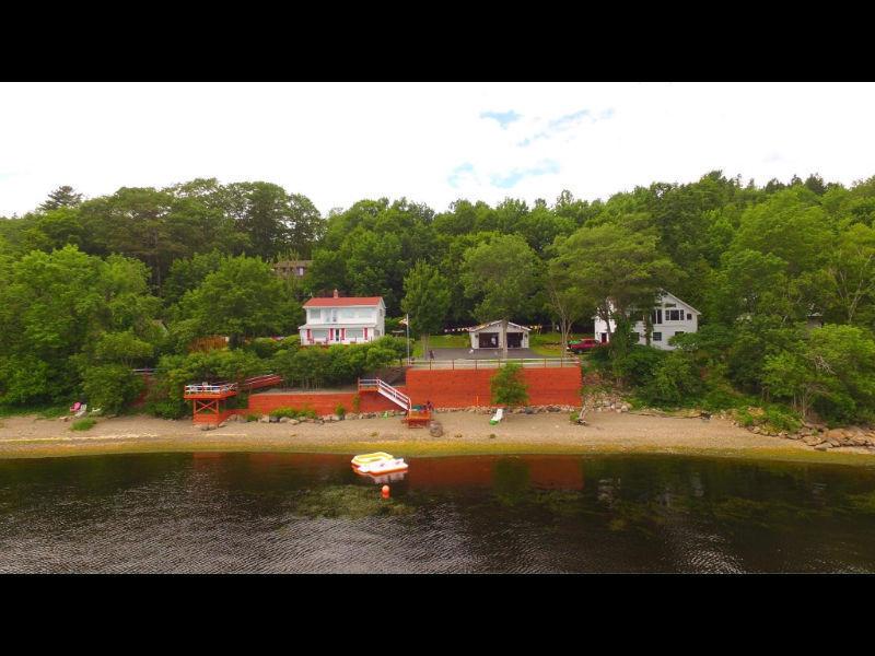 225 FT WATERFRONT HOME WITH (2) SEPERATE GARAGES