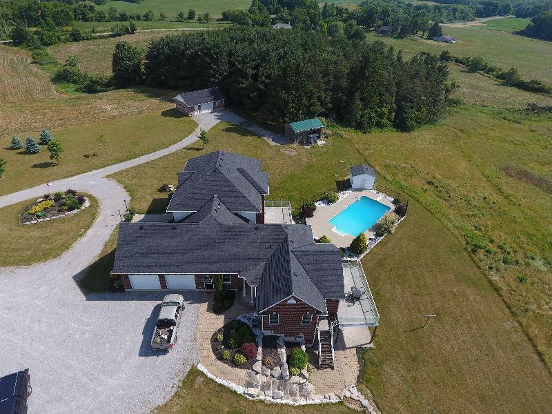 21.5 acres with custom built home w/inlaw/guest suite