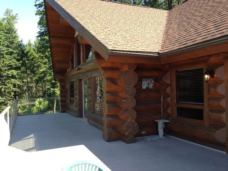 Log home for sale on the Kootenay Lake